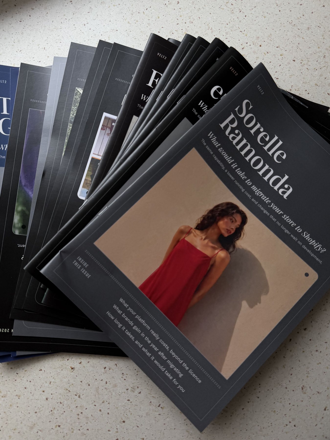 Shopify migration editions fanned out, each cover a different fashion brand