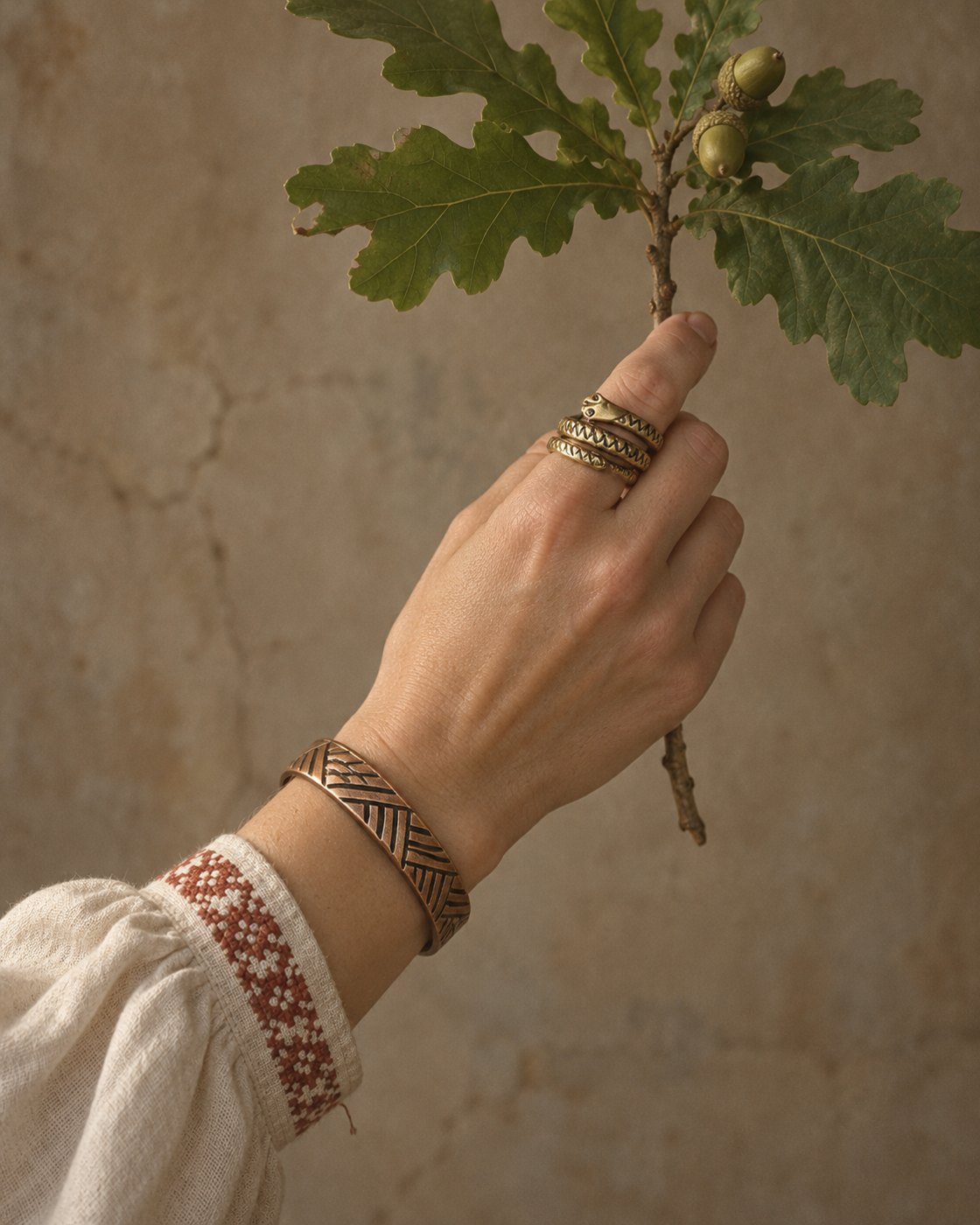 Brass bracelet and snake ring with an oak branch